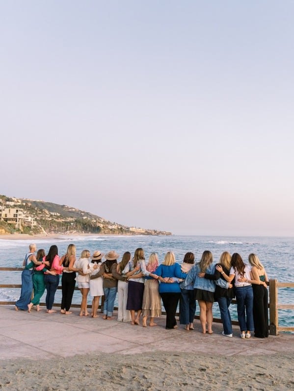 Women gathered at the ocean