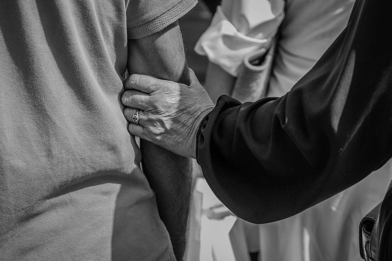 Hands held in support